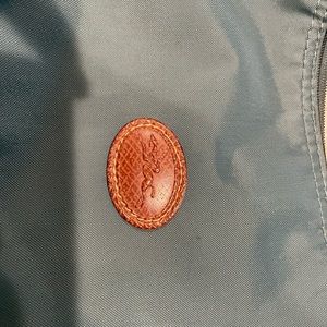 Great size Longchamp bag. No stains at all. Picture has shadows.